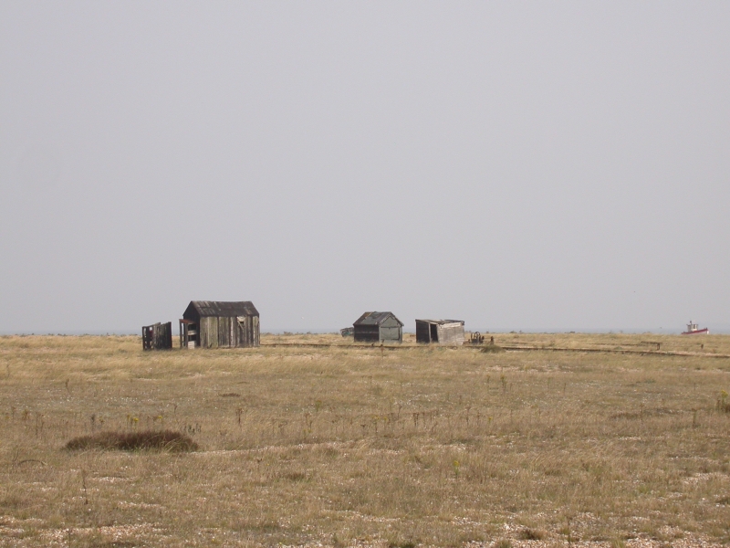 DSCN2136.JPG - Sheds, boats and unknown constructions litter parts of the shingle sea.